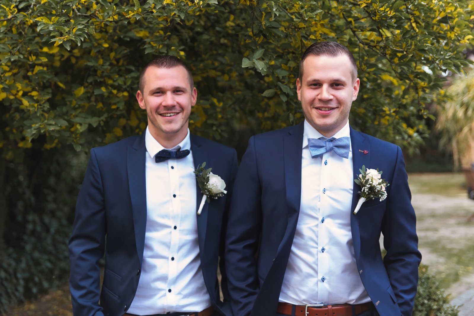 private wedding party with groom in blue and bride in white and cowgirl