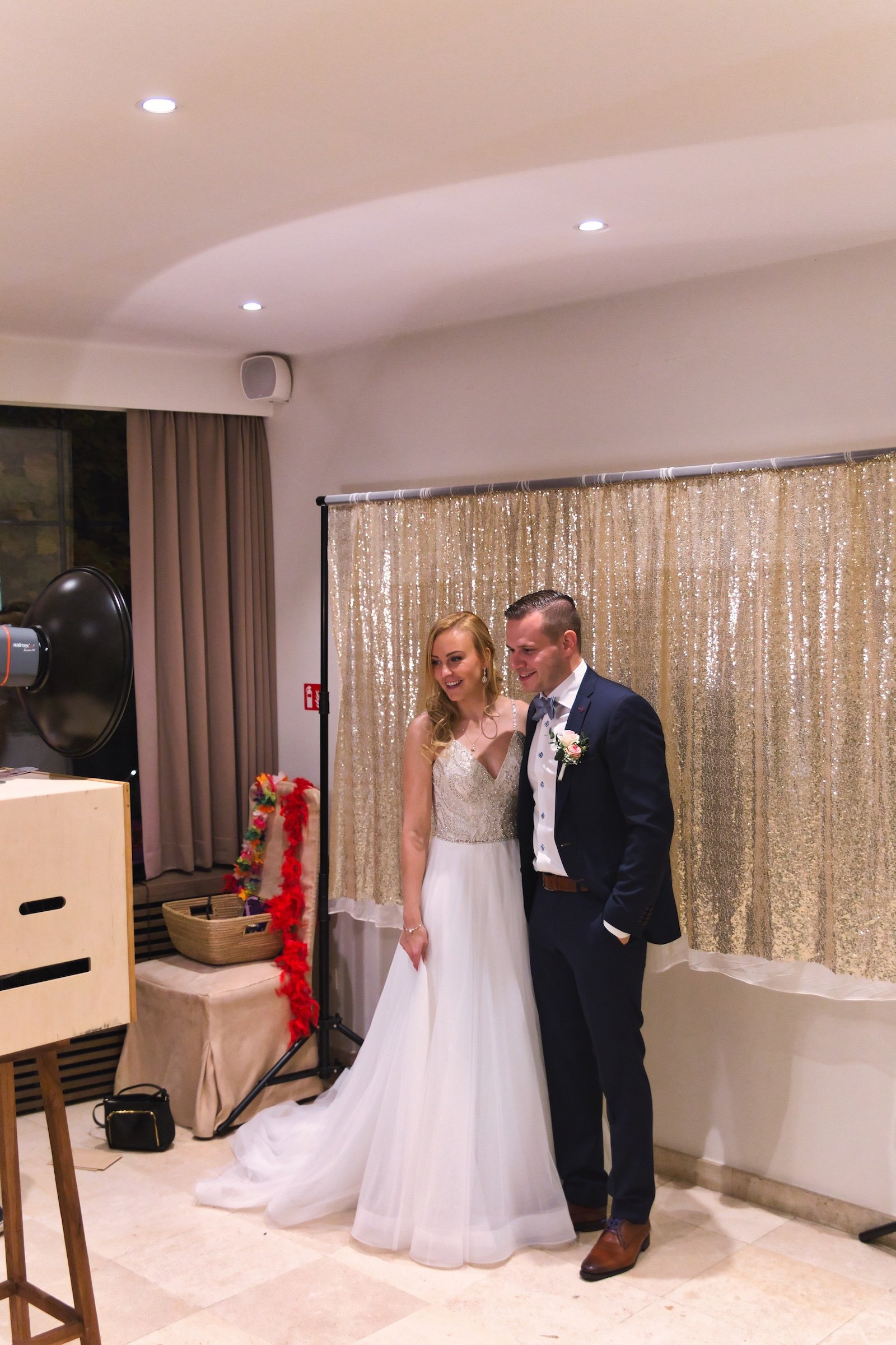 private wedding party with groom in blue and bride in white and cowgirl