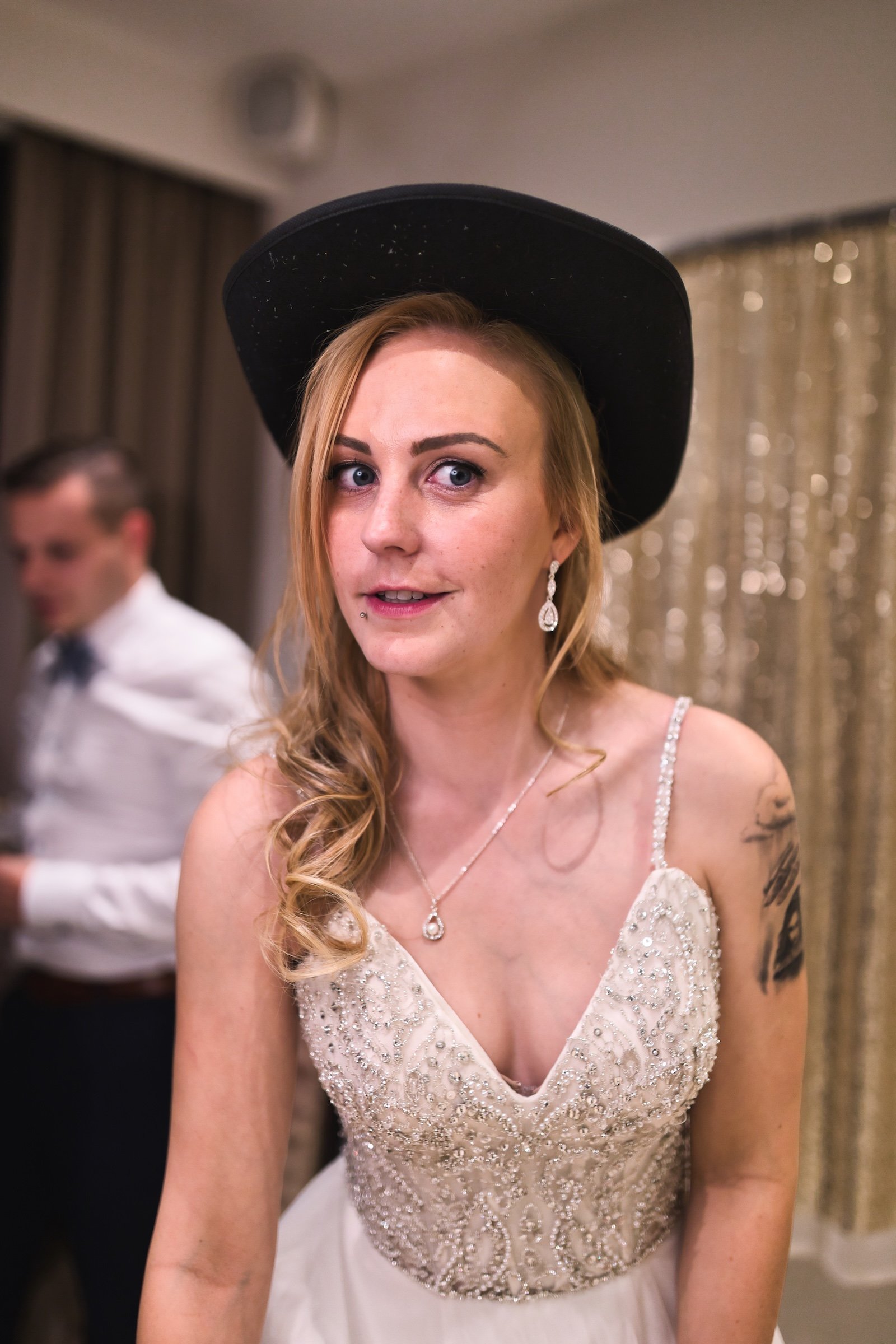 private wedding party with groom in blue and bride in white and cowgirl